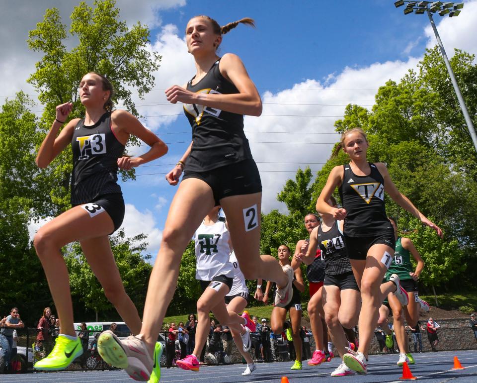 Eventual winner Abby Downin of Tatnall (2) runs at the start of the 800 meter race with Anna Bockius of Padua (second place finisher, left) and Tatnall's Katie Payne (fourth place finisher, right) during the New Castle County track and field championships, Saturday, May 11, 2024 at Abessinio Stadium.