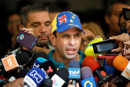 Venezuela's opposition leader Henrique Capriles speaks to the media after casting his vote during a nationwide elections for new governors in Caracas, Venezuela, October 15, 2017. REUTERS/Carlos Garcia Rawlins