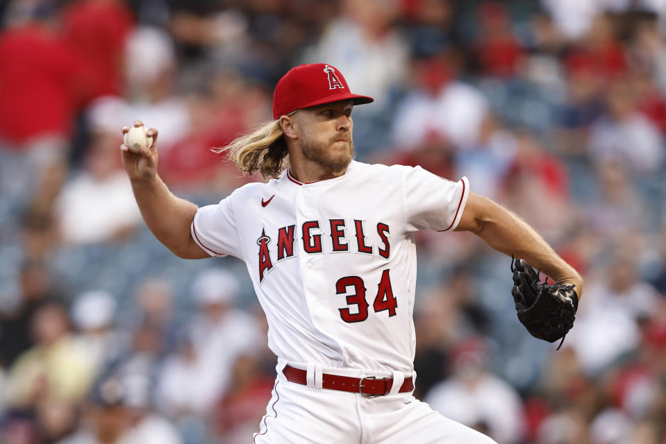 ANAHEIM, CALIFORNIA - APRIL 09: Noah Syndergaard #34 of the Los Angeles Angels pitches against the Houston Astros during the first inning at Angel Stadium of Anaheim on April 09, 2022 in Anaheim, California. (Photo by Michael Owens/Getty Images)