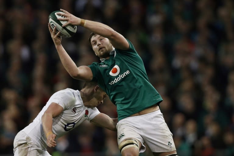 Ireland's lock Iain Henderson (R) is tackled by England's centre Owen Farrell during a Six Nations match in Dublin, in March 2017