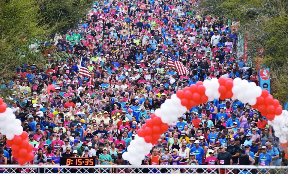 Thousands of runners in the back of the pack make their way to the starting line on  East Duval Street as they start the 15K 2022 Gate River Run Saturday, March 5, 2022 in Jacksonville, Florida.