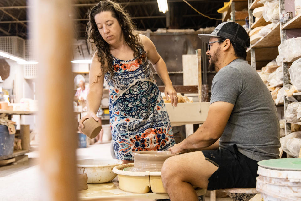 Hector and Melissa Cobos Leon make pottery dishes in their studio in Paseo Pottery in Oklahoma City on Thursday, May 19, 2022.