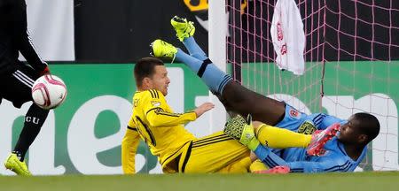 Oct 25, 2015; Columbus, OH, USA; Columbus Crew SC forward Jack McInerney (30)collides with D.C. United goalkeeper Bill Hamid (28) during the second half at MAPFRE Stadium. Mandatory Credit: Joe Maiorana-USA TODAY Sports