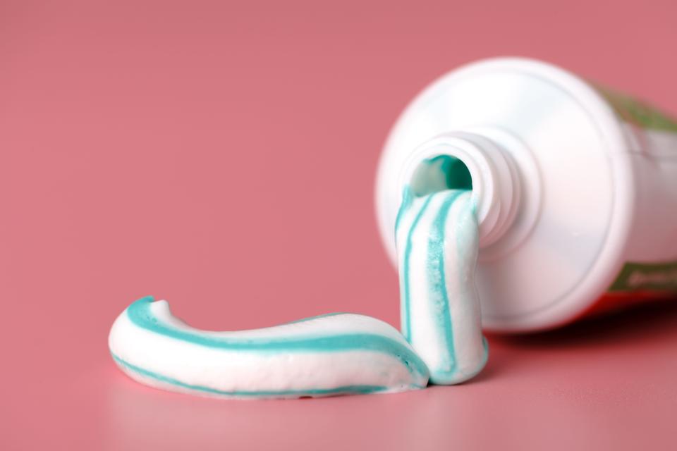 Toothpaste squeezed out of a tube.