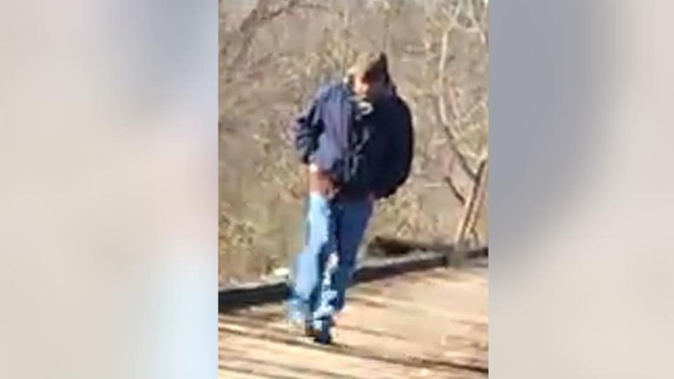 <div class="inline-image__caption"><p>A man was captured on a brief video on German’s cellphone wearing a blue jacket and walking on an abandoned railroad bridge at 2:13 p.m. on Feb. 13, 2017.</p></div> <div class="inline-image__credit">FBI</div>