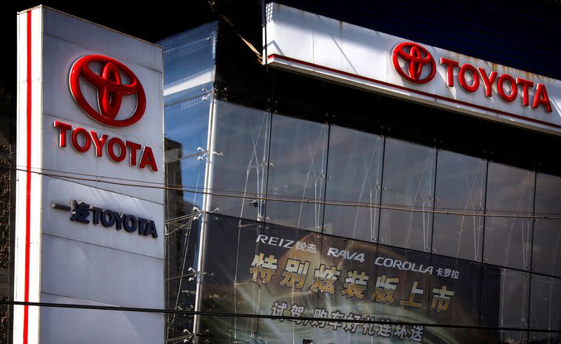 FILE PHOTO: A sign is seen outside a Tianjin Faw Toyota Motor Co. Ltd showroom, a joint venture between China's Tianjin FAW Xiali Automobile Co Ltd and Japan's automaker Toyota Motor Corp, in central Beijing