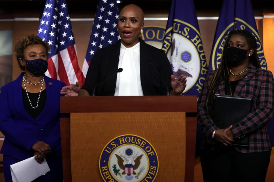 U.S. Rep. Ayanna Pressley (D-MA) speaks as Rep. Barbara Lee (D-CA) (L) and Rep. Cori Bush (D-MO) (R) listen during a news conference at the U.S. Capitol December 8, 2021 in Washington, DC. (Photo by Alex Wong/Getty Images)