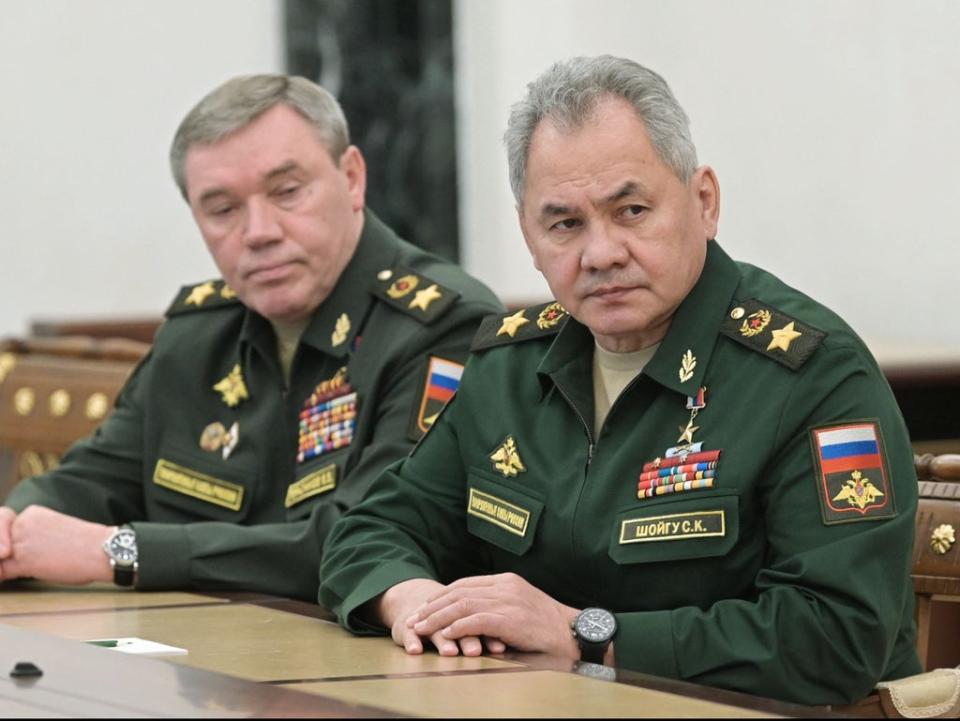 Russian Defence Minister Sergei Shoigu (R) and chief of the general staff Valery Gerasimov attend a meeting with Russian President in Moscow on 27 February (Alexey Nikolsky/Sputnik/AFP via Getty Images)