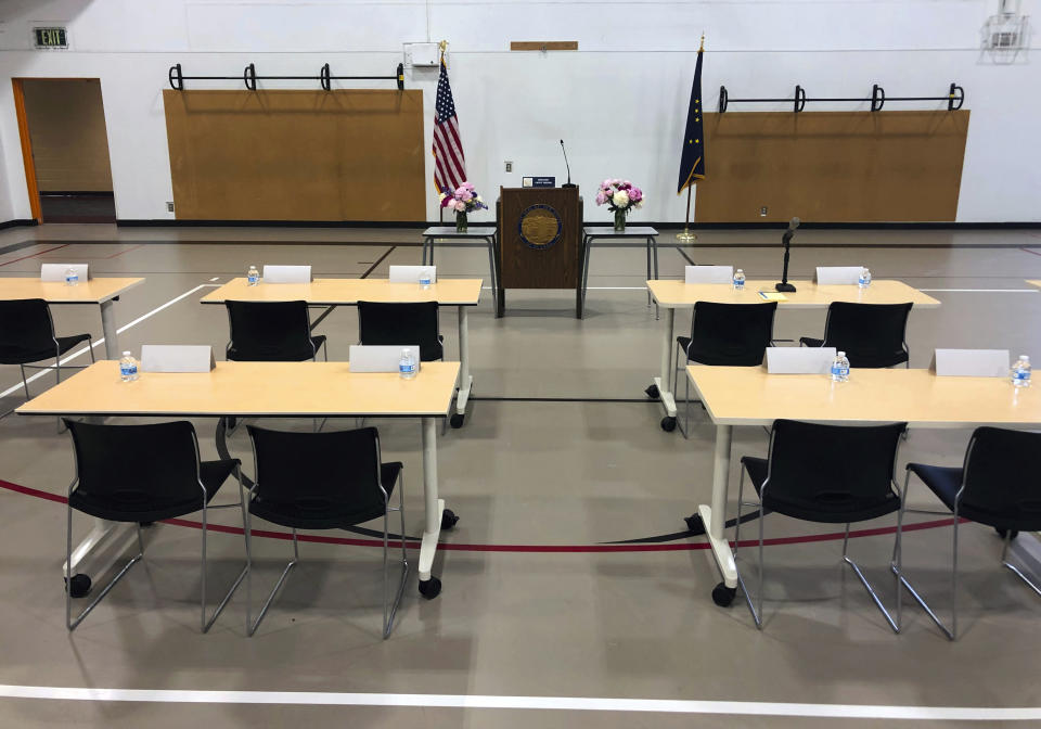 Desks for the Alaska state representatives who are not attending the special session in Juneau are set up inside a small gym at Wasilla Middle School in Wasilla, Alaska, on Monday, July 8, 2019. In a rare move, nearly a third of Alaska lawmakers are expected to buck their leadership in both chambers and meet Monday in Wasilla even though a majority of lawmakers will convene the special session in Juneau, the state capital, about 600 miles away. (AP Photo/Mark Thiessen)