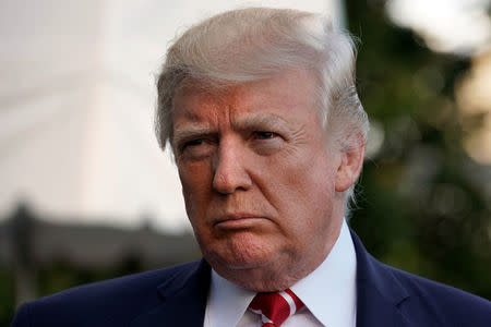 FILE PHOTO: U.S. President Donald Trump talks to the media on South Lawn of the White House in Washington before his departure to Greensboro, North Carolina, U.S., October 7, 2017. REUTERS/Yuri Gripas