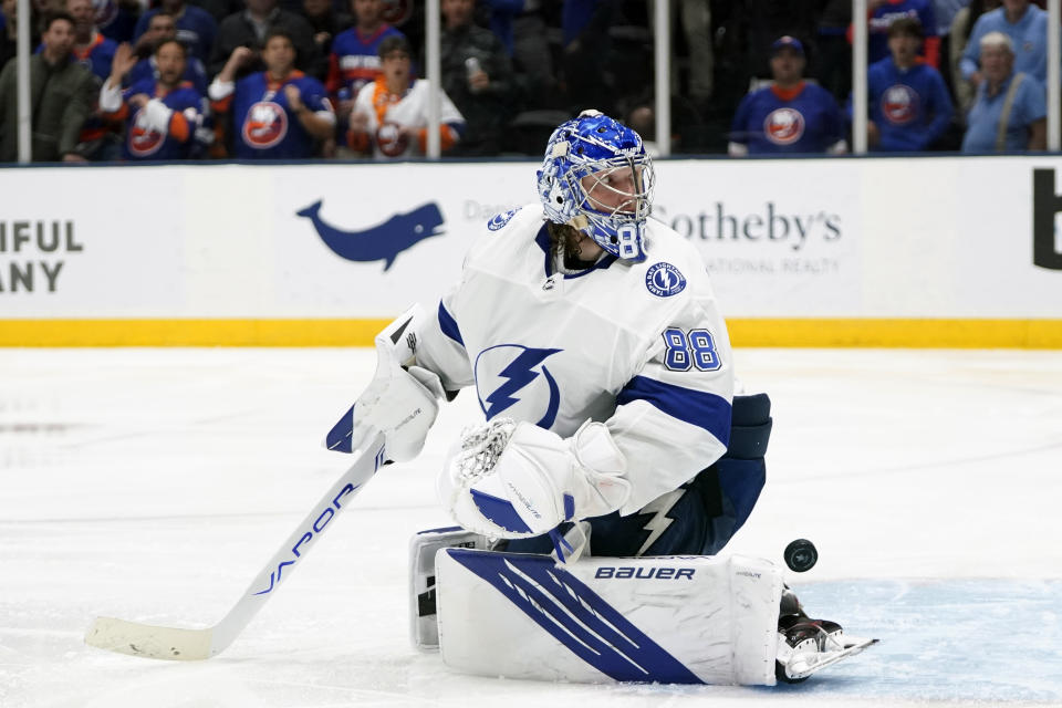 Fans cheer as Tampa Bay Lightning goaltender Andrei Vasilevskiy (88) reacts after New York Islanders' Anthony Beauvillier scored a goal during the overtime period of Game 6 of an NHL hockey semifinals Wednesday, June 23, 2021, in Uniondale, N.Y. The Islanders won 3-2. (AP Photo/Frank Franklin II)