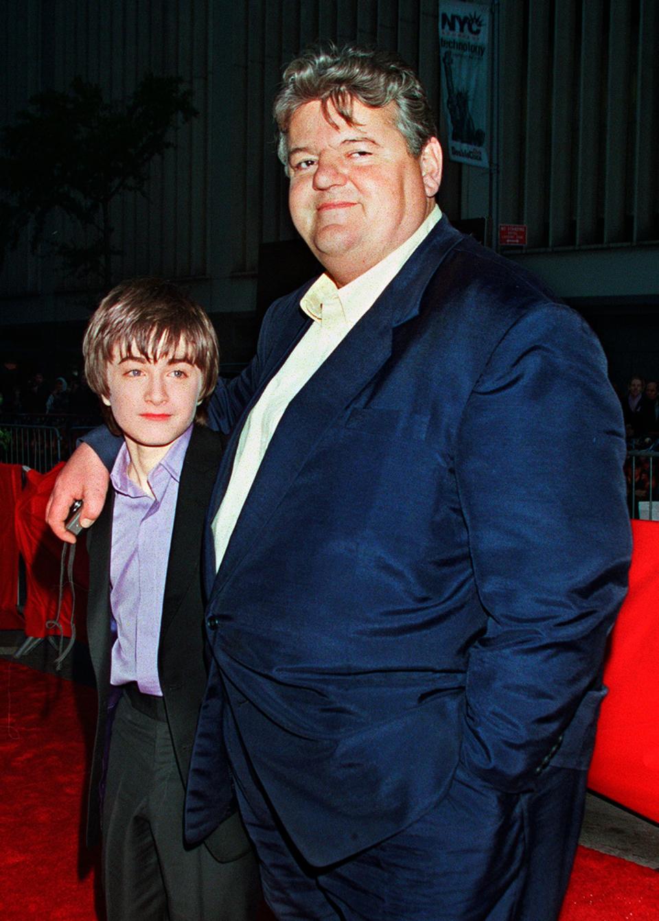 Daniel Radcliffe, left, who played Harry Potter, and Robbie Coltrane, who played Hagrid, arrive for the film's New York premiere on Nov. 11, 2001.