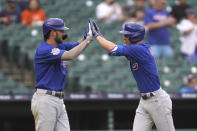 Chicago Cubs' Matt Duffy, right, celebrates his three-run home run with Kris Bryant in the fifth inning of a baseball game against the Detroit Tigers in Detroit, Saturday, May 15, 2021. (AP Photo/Paul Sancya)