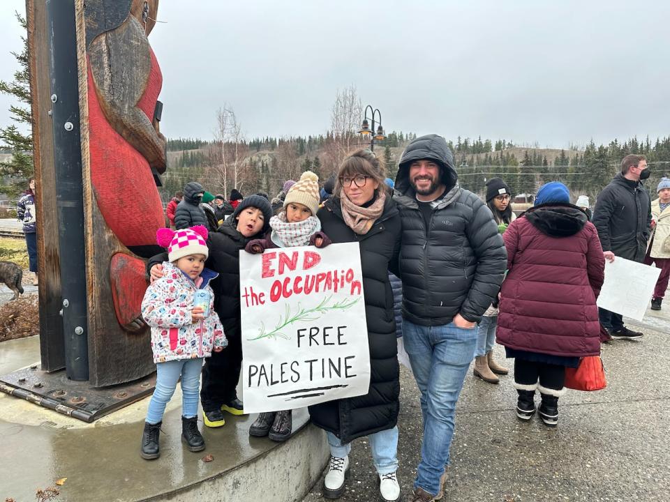 A family protesting in Whitehorse on Nov. 4. 