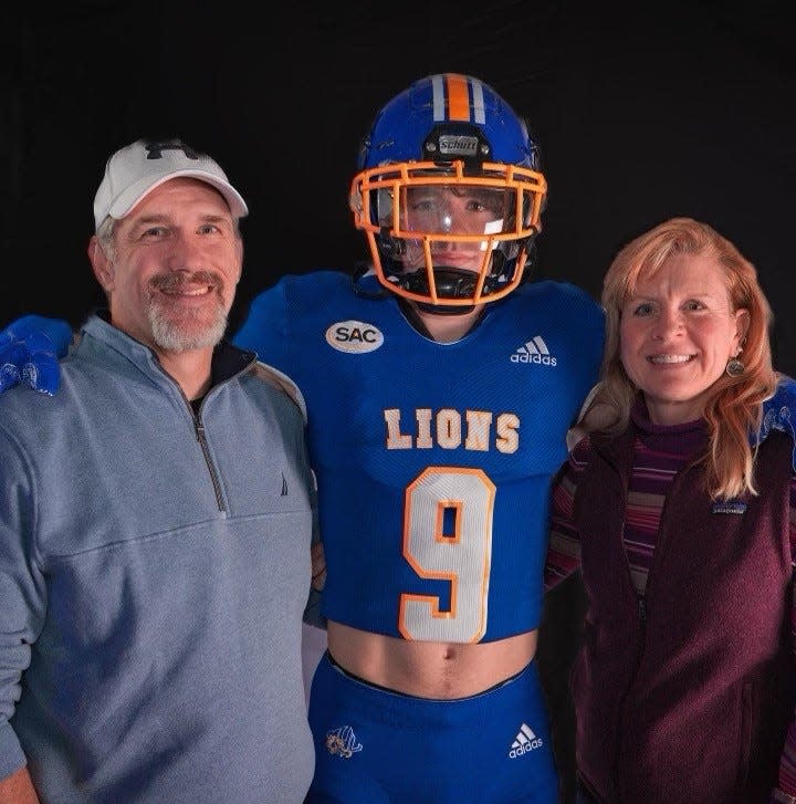 Madison High 2023 graduate Caden Hilemon, pictured here with his parents, Bobby "Bear" Hilemon and Angel Hilemon, has verbally committed to play football at Mars Hill University.