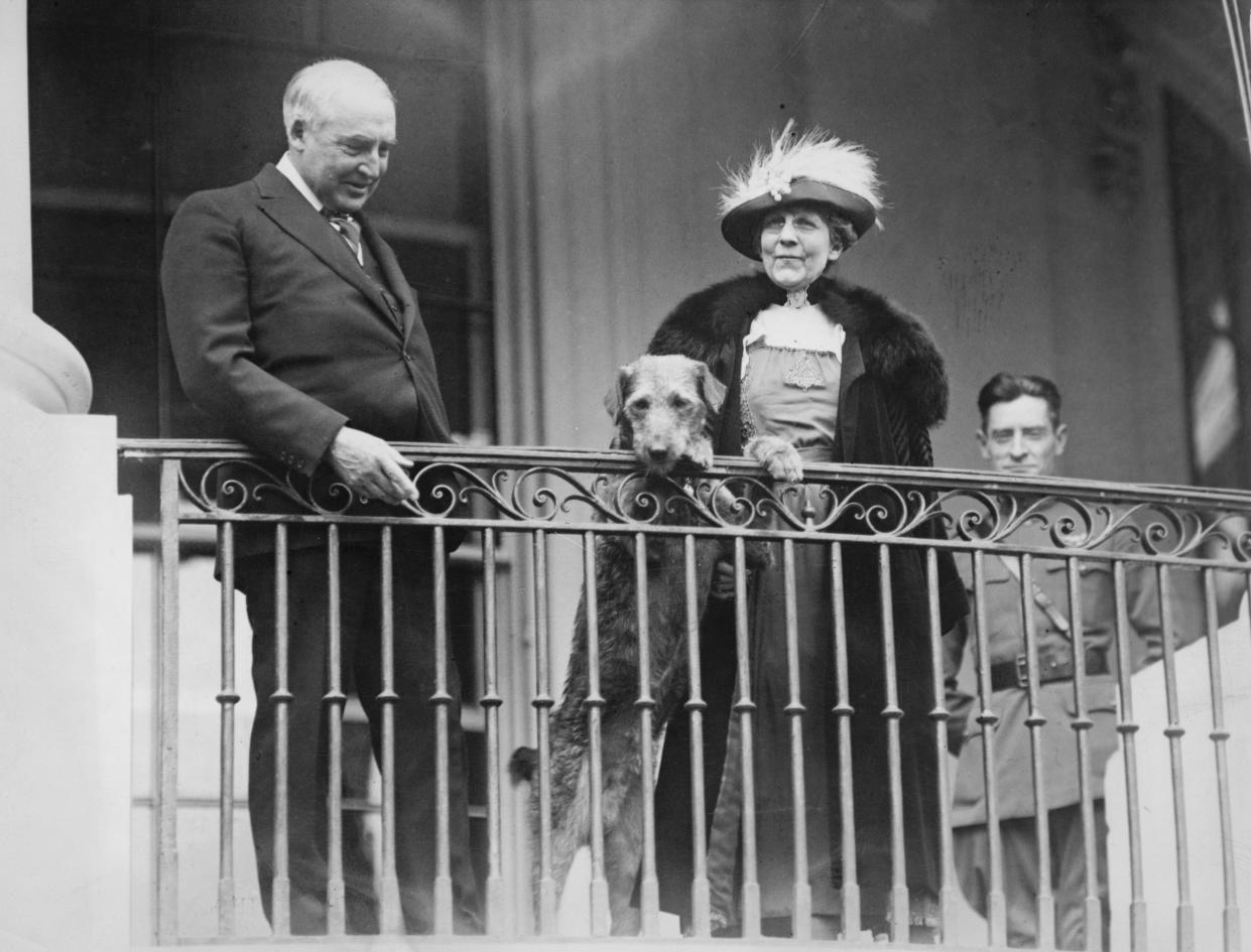 Warren G Harding and Florence Harding on a balcony with their pet dog, Laddie Boy, Washington DC, circa 1922. (Getty Images)