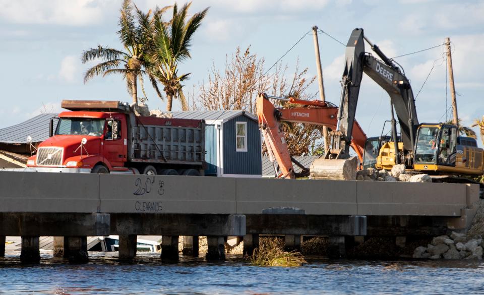 Workers work to repair the bridge to Pine Island near Fort Myers, Fla., on Wednesday October 5, 2022. Hurricane Ian hit the southwest Florida coast on Wednesday September 28th.