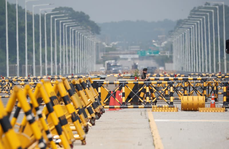 A soldier stands guard at a checkpoint on the Grand Unification Bridge which leads to the inter-Korean Kaesong Industrial Complex in North Korea, just south of the demilitarized zone separating the two Koreas, in Paju