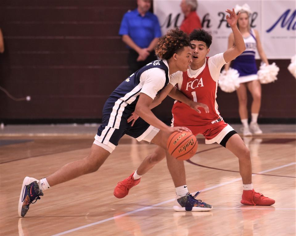 Abilene Cooper's Andrew Gonzalez of the South team, right, defends against Abilene High's Hayden Williams of the North during the second half. The South won 89-73 in the Big Country FCA's All-Star Men's Basketball Game on Saturday, June 4, 2022, at Brownwood High School.