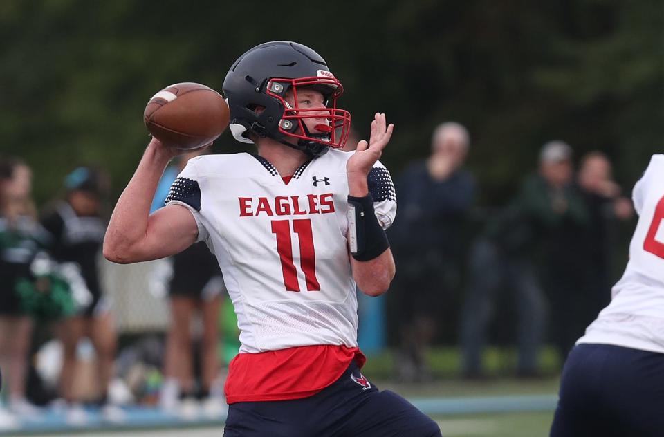 Eastchester quarterback Aidan Schultz (11) looks for an open receiver against Brewster during football action at Brewster High School Sept. 30, 2023. Eastchester won the game 21-0. 