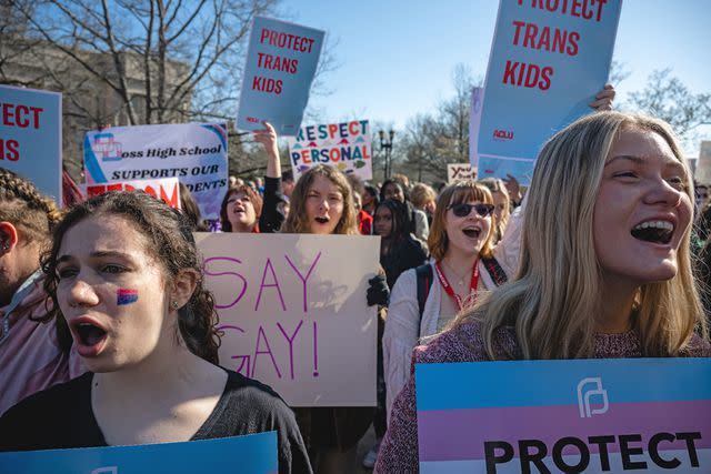<p>Jon Cherry/Getty</p> Demonstrators protest the passing of a "Don't Say Gay" bill in Kentucky on March 29, 2023