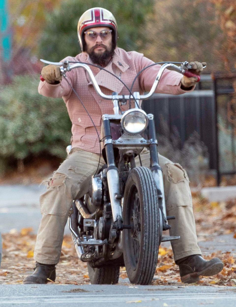 <p>Jason Momoa rides his Harley-Davidson through Toronto on Wednesday. </p>