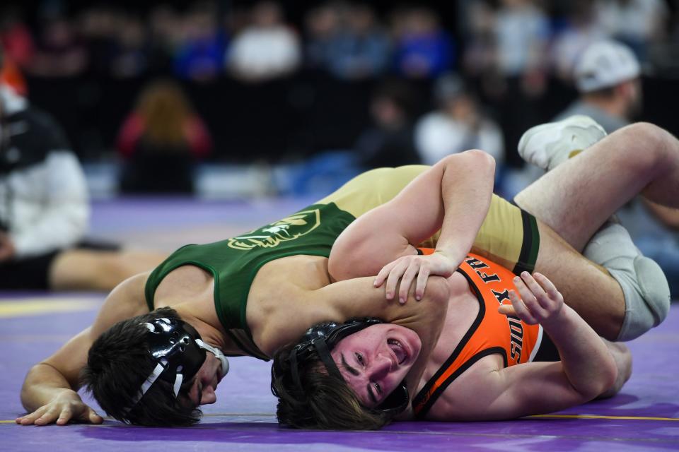 S.F. Washington’s Brayden Pueppke is pinned down by S.F. Jefferson’s Austin Osborn on Friday, Feb. 23, 2024 at the Denny Sanford Premier Center in Sioux Falls.