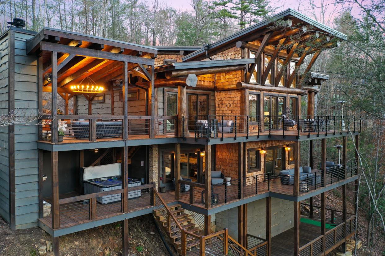 Miracle Creek Retreat sits on a hill, overlooking a creek in the Blue Ridge area. Vrbo highlights amenities like "spa-like bathrooms, a generously stocked gourmet kitchen with river views, and a game room with a wet bar."