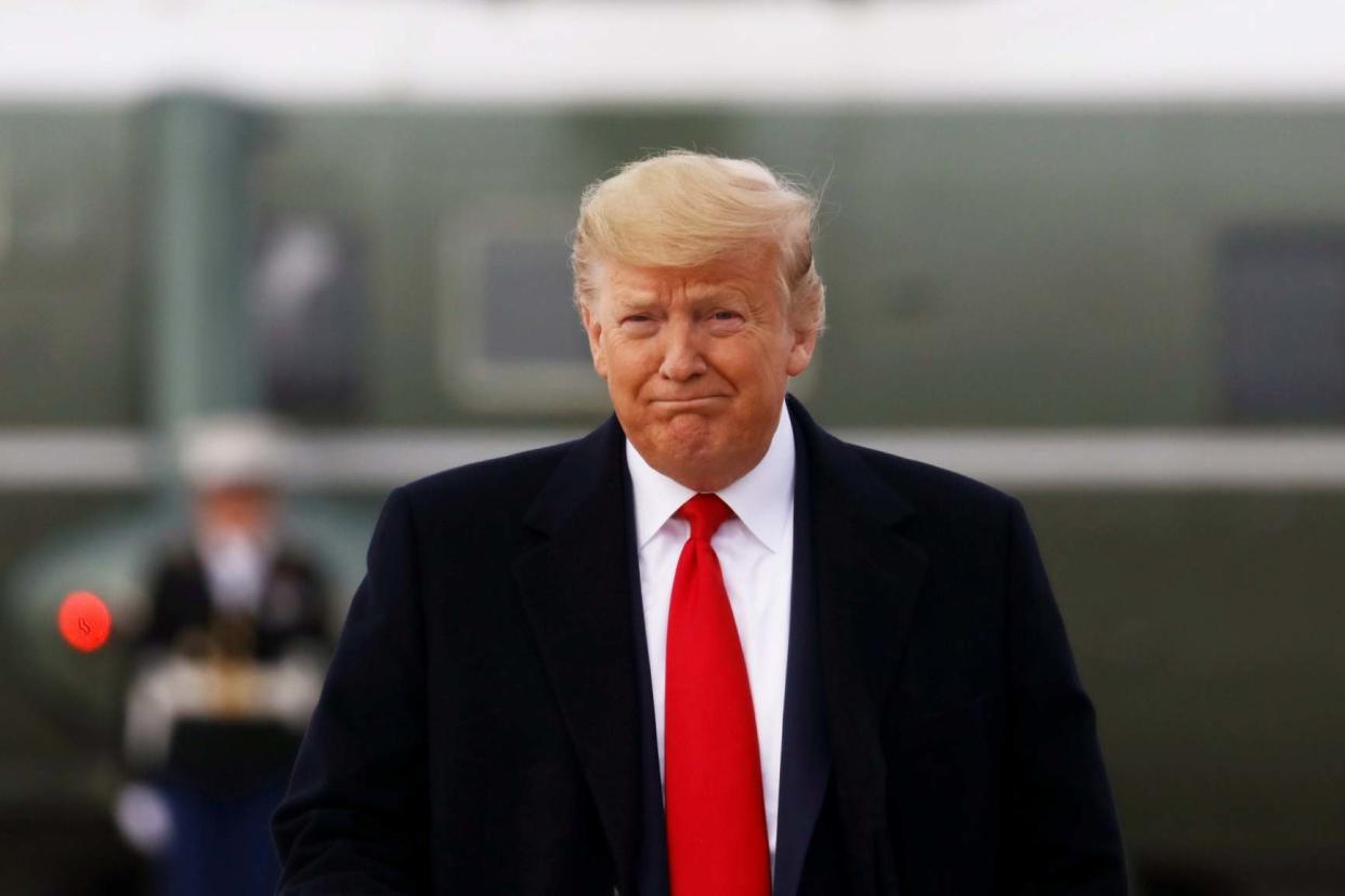 Donald Trump gives a thumbs up as he boards Air Force One: REUTERS