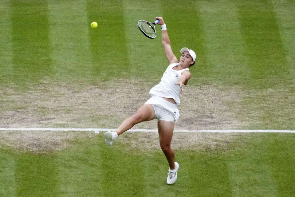 Australia's Ashleigh Barty plays a return to compatriot Ajla Tomljanovic during the women's singles quarterfinals match on day eight of the Wimbledon Tennis Championships in London, Tuesday, July 6, 2021. (AP Photo/Alberto Pezzali)