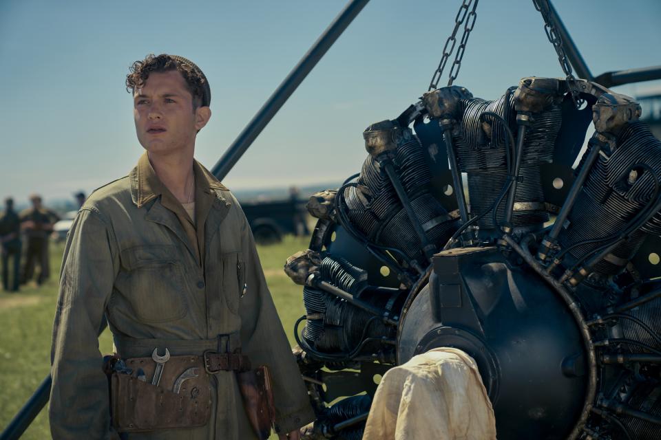 Aircraft mechanic standing in front of engine on Masters of the Air.