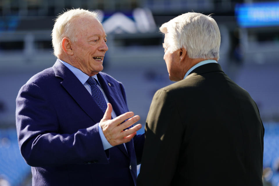 Dallas Cowboys owner Jerry Jones talks with former coach Jimmy Johnson before an NFL football game between the Carolina Panthers and the Dallas Cowboys on Sunday, Nov. 19, 2023, in Charlotte, N.C. (AP Photo/Rusty Jones)