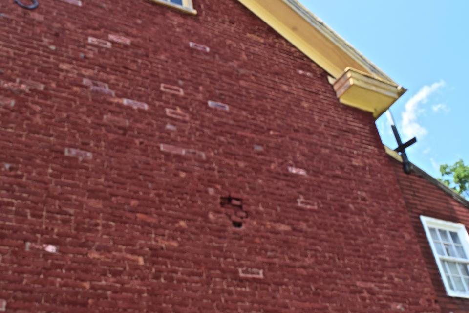 The eastern wall of the Gloss-Boyer home in Sharpsburg is pockmarked with artillery damage from the Battle of Antietam.