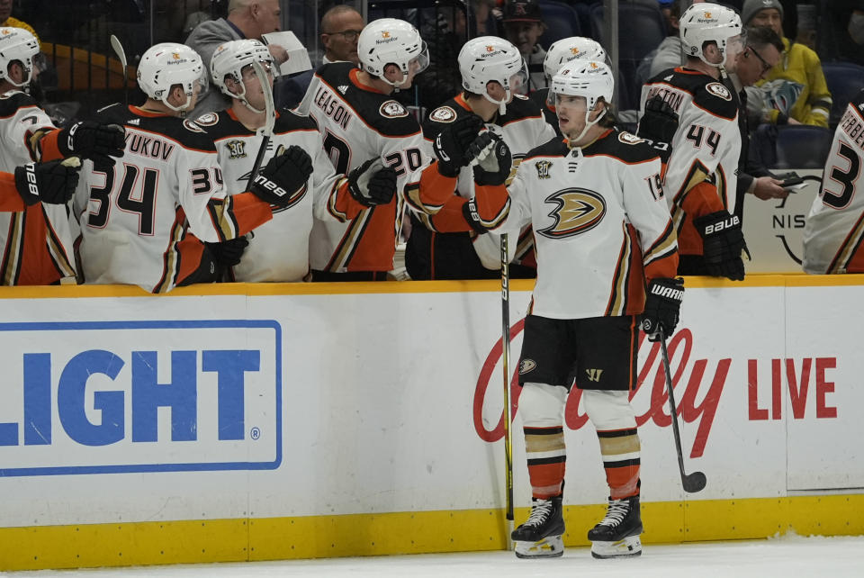 Anaheim Ducks right wing Troy Terry (19) celebrates a goal with teammates during the second period of an NHL hockey game against the Nashville Predators, Tuesday, Jan. 9, 2024, in Nashville, Tenn. (AP Photo/George Walker IV)