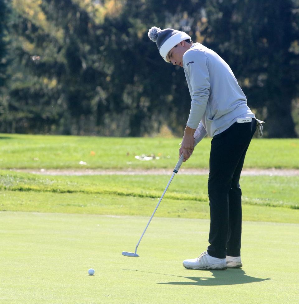 Individual winner Dante Bertoni of Union-Endicott putts at Elmira's Mark Twain Golf Course during the Southern Tier Athletic Conference golf championships Oct. 11, 2022. He shot an even-par 72.