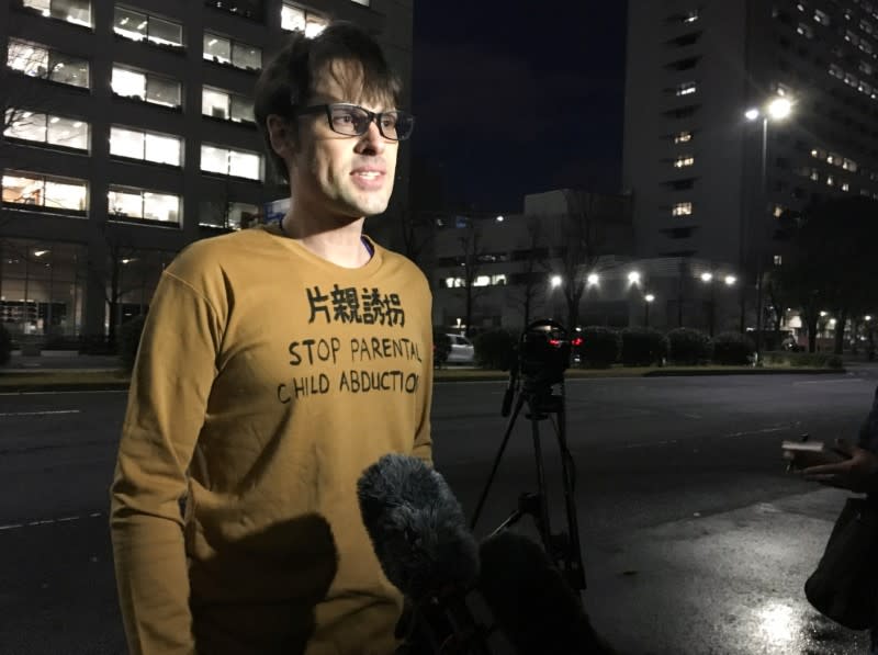 Scott McIntyre, an Australian sports journalist, speaks outside the Tokyo District Court after spending a month and a half in jail on charges of trespassing to find his missing children, in Tokyo