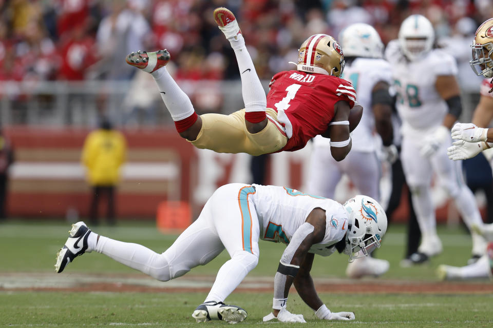 San Francisco 49ers cornerback Jimmie Ward (1) intercepts a pass over Miami Dolphins running back Jeff Wilson Jr. during the second half of an NFL football game in Santa Clara, Calif., Sunday, Dec. 4, 2022. (AP Photo/Jed Jacobsohn)