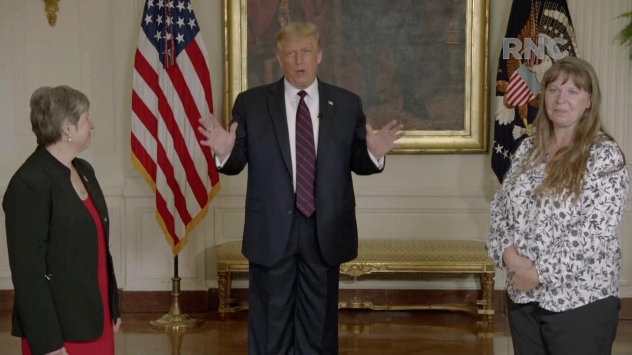 Donald Trump, flanked by essential workers during the coronavirus disease outbreak, speaks by video feed during the largely virtual 2020 Republican National Convention broadcast from Washington DC: via REUTERS