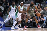 Dallas Mavericks forward Tim Hardaway Jr. and guard Frank Ntilikina (21) defend against Brooklyn Nets guard James Harden (13) during the first half of an NBA basketball game in Dallas, Tuesday, Dec. 7, 2021. (AP Photo/Tony Gutierrez)