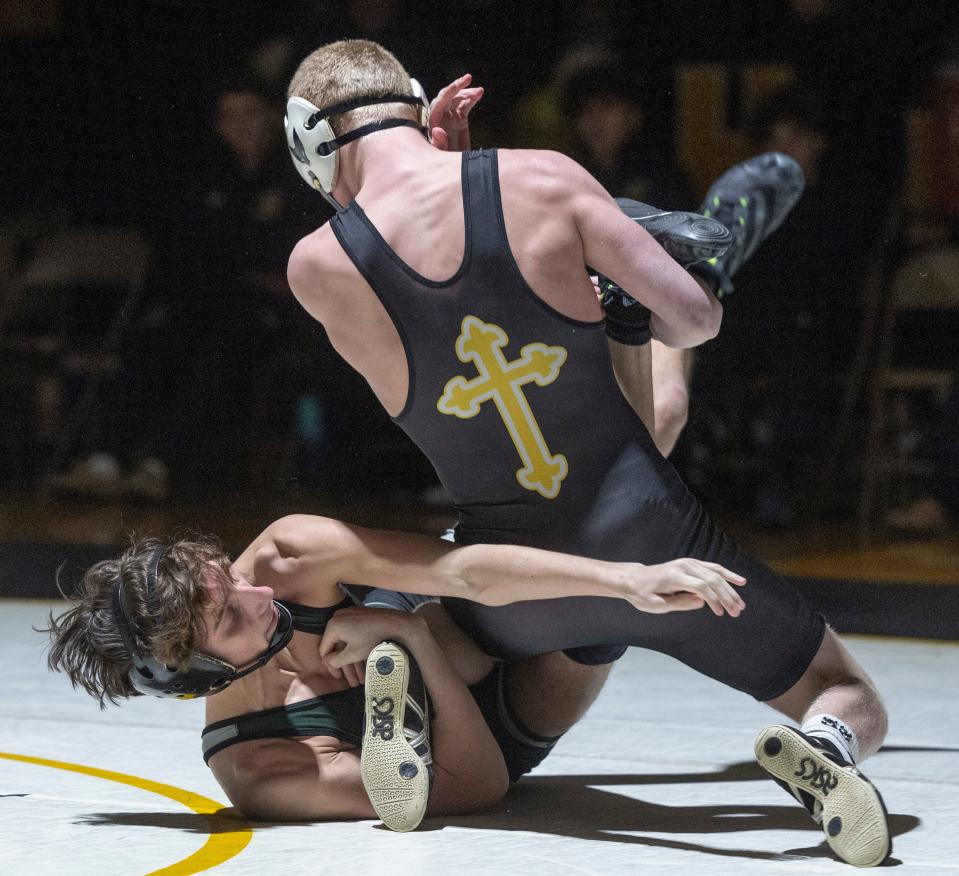 St. John Vianney's Patrick O'Keefe (with his back to the camera) is shown during his 19-5 major decision win at 120 pounds over Matt Erven in the Lancers' 41-24 win over Raritan Wednesday night.