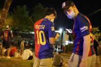 Barcelona fans are seen outside the Camp Nou after captain Lionel Messi told Barcelona he wishes to leave the club immediately