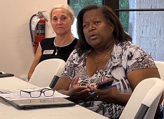 Lydia Gregg, right, of Mid-Florida Housing Partnership speaks as Debora Crane of Fairway Independent Mortgage Corp. looks on at an April 14, 2022 meeting of the organizers of the upcoming 2022 Housing Fair & Financial Clinic set for April 30, 10 a.m. to 2 p.m. at the Allen Chapel AME Church parking lot at 580 George W. Engram Blvd. in Daytona Beach.