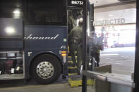 In this Thursday, Feb. 13, 2020 photo, agents for Customs and Border Protection board a Greyhound bus headed for Portland, Ore., at the Spokane Intermodal Center, a terminal for buses and Amtrak, in Spokane, Wash. A Customs and Border Protection memo obtained by The Associated Press confirms that bus companies such as Greyhound do not have to allow Border Patrol agents on board to conduct routine checks for illegal immigrants, contrary to Greyhound's long insistence that it has no choice but to let the agents on board. (AP Photo/Nicholas K. Geranios)