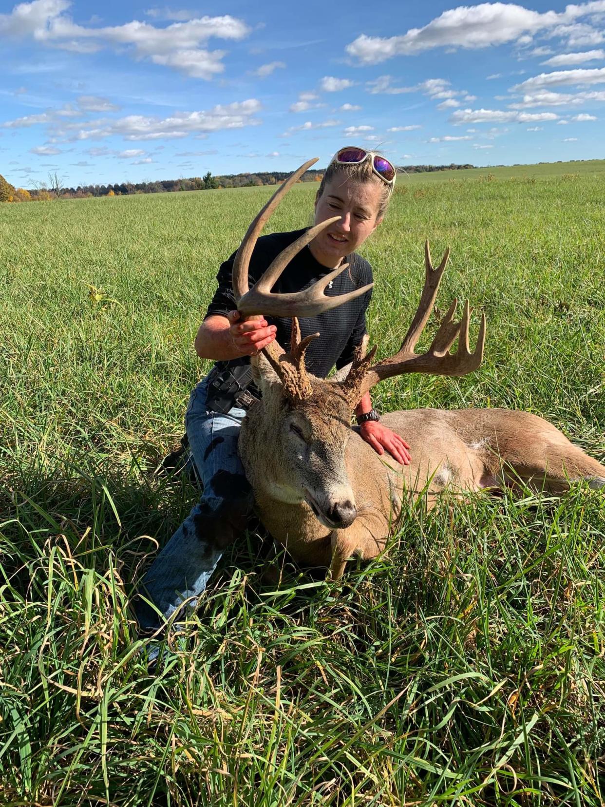 Steph Genet, 29, of Nashville, shows off the 15-point buck she killed with a compound bow Oct. 31. She was hunting in Wayne County on her grandmother's farm.