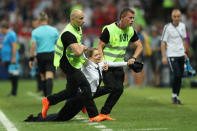 Soccer Football - World Cup - Final - France v Croatia - Luzhniki Stadium, Moscow, Russia - July 15, 2018 Stewards apprehend a pitch invader REUTERS/Carl Recine