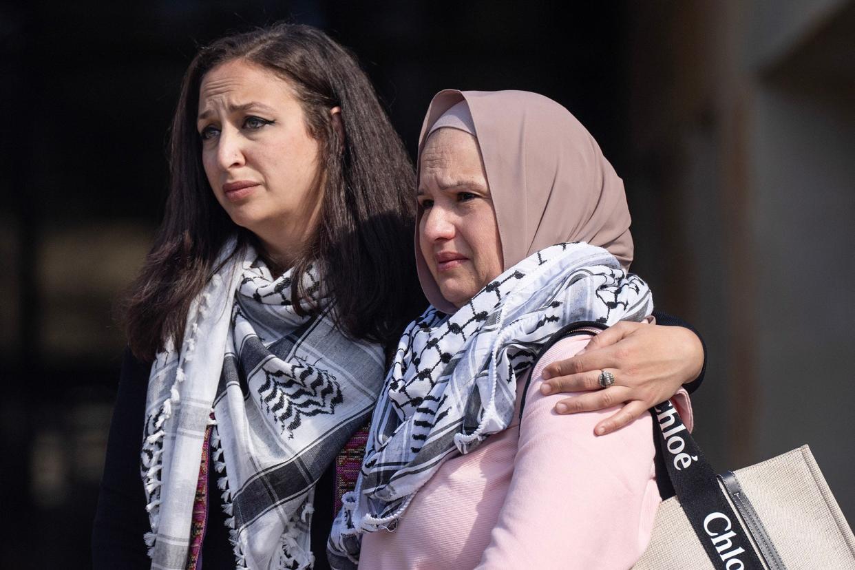 Shaimaa Zayan, left, holds Odi Doar, the mother of stabbing victim Zacharia Doar, as they stand near the podium during a press conference at Austin City Hall on Tuesday, Feb. 6, 2024. Zacharia Doar, a Palestinian American, was targeted in a West Campus stabbing, an Islamic advocacy group says.