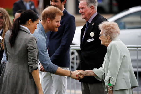 Britain's Prince Harry and his wife Meghan, Duchess of Sussex arrive for a community picnic at Victoria Park in Dubbo, Australia October 17, 2018. REUTERS/Phil Noble