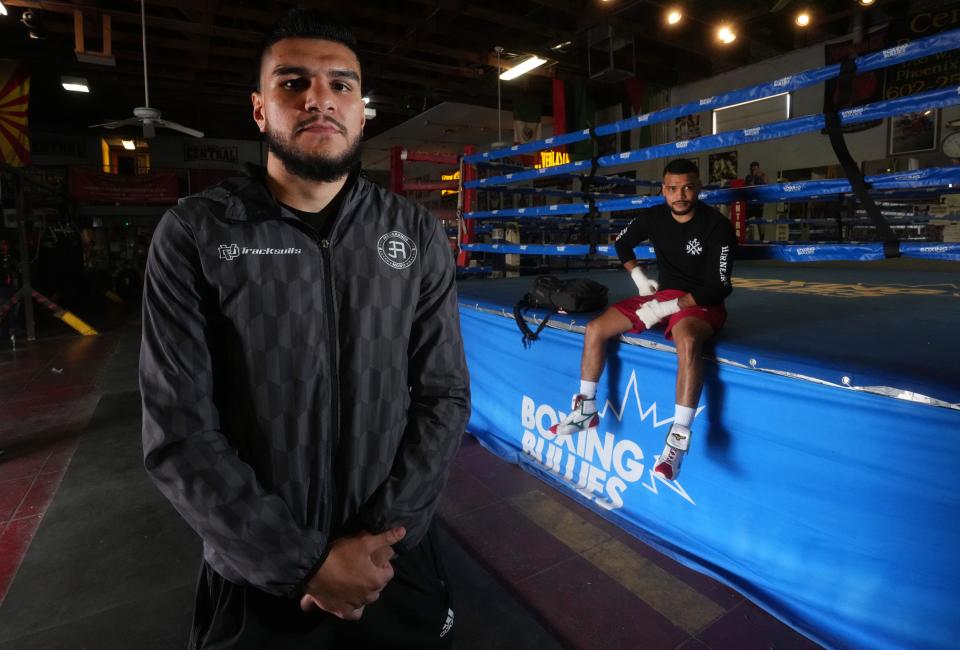Jesus Ramos (left) and his uncle Abel Ramos sit ringside at Central Boxing Gym in Phoenix on March 1, 2023. The two Casa Grande boxers are scheduled on the same card for a fight at the MGM Grand in Las Vegas on March 25.