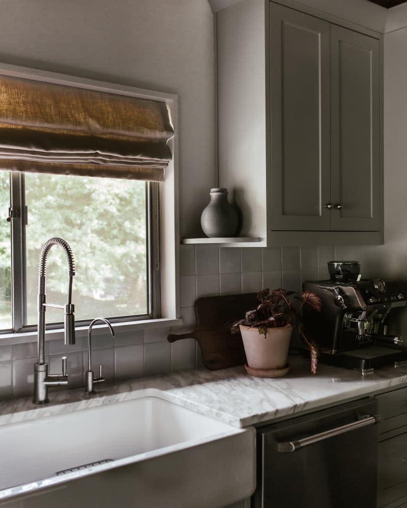 <span>Little touches make the kitchen feel special, like the tiny shelf for display pottery next to the sink. Credit: <a href="http://www.kristinkarch.com/" rel="nofollow noopener" target="_blank" data-ylk="slk:Kristin Karch;elm:context_link;itc:0;sec:content-canvas" class="link ">Kristin Karch</a></span> <span class="copyright">Credit: <a href="http://www.kristinkarch.com/" rel="nofollow noopener" target="_blank" data-ylk="slk:Kristin Karch;elm:context_link;itc:0;sec:content-canvas" class="link ">Kristin Karch</a></span>