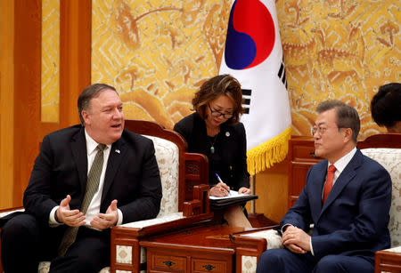 U.S. Secretary of State Mike Pompeo talks with South Korean President Moon Jae-in during their meeting at the presidential Blue House in Seoul, South Korea, October 7, 2018. REUTERS/Kim Hong-Ji/Pool